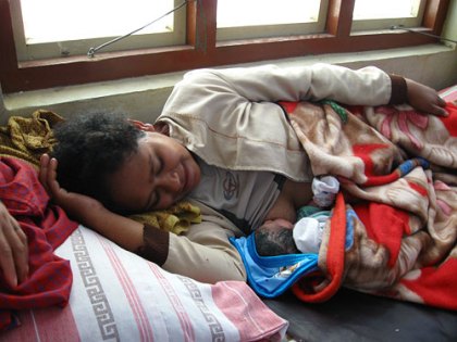 a West Timor mother with her baby in the hospital